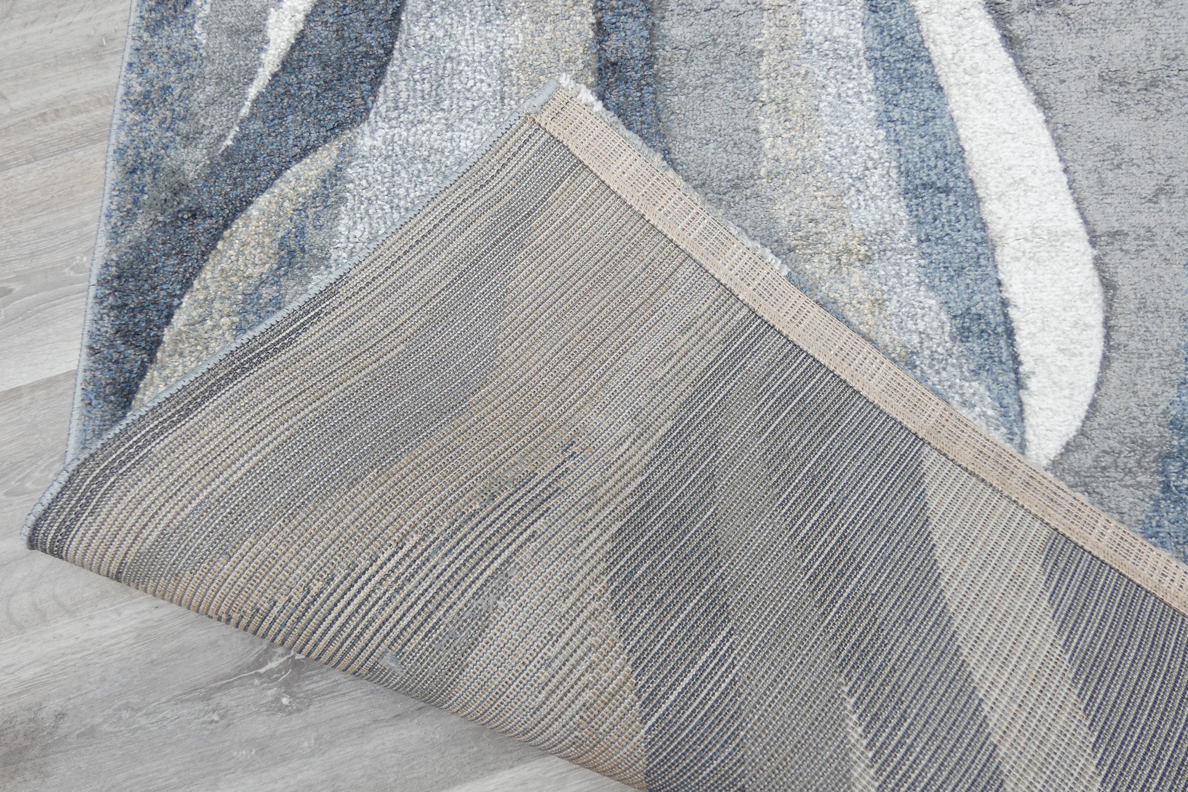 Kimya Collection Abstract Wave Rug in Navy and Neutral Tones – Fluid Contemporary Design